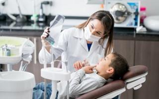 Dentist discussing with patient